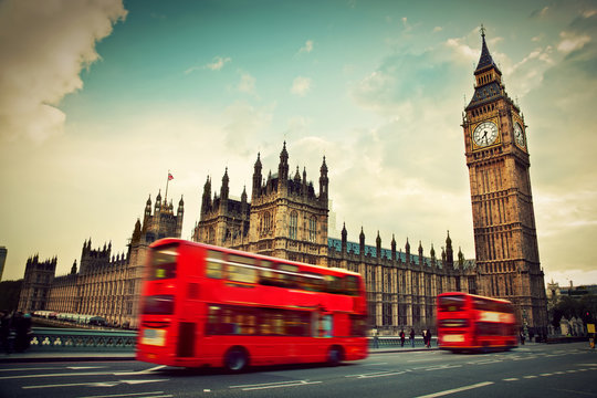 Fototapeta London, the UK. Red bus in motion and Big Ben