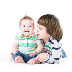 Siblings playing together, on white