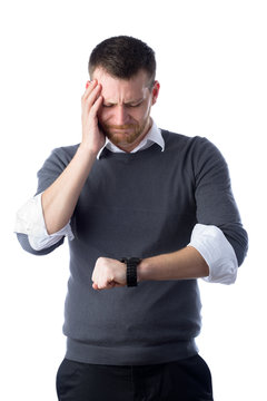 Young Man Looking Worried At Watch