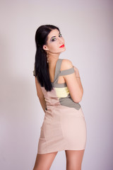 Fototapeta premium Portrait of beautiful young brunette woman in studio
