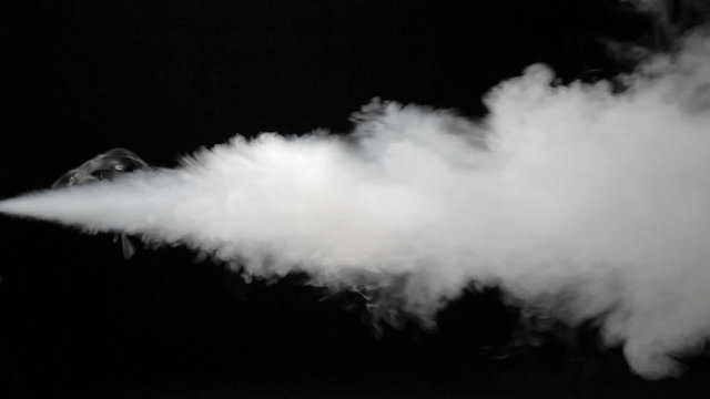White spray of smoke isolated on black
