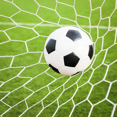 football in the goal net