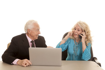 elderly couple her plug ear on phone computer
