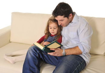 Father telling fairy tale to cute little daughter