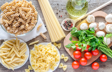 Various pasta with mushrooms and cherry tomatoes
