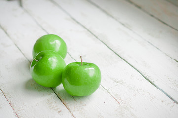 Fresh farm raised apples on rustic wooden background