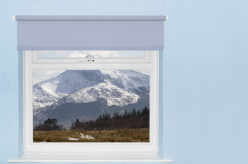 View of snow covered mountain from window
