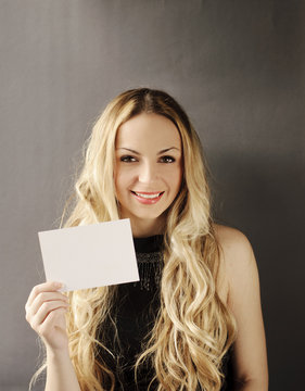 Girl holding a blank card