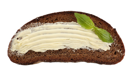 Slice of rye bread with butter, isolated on white