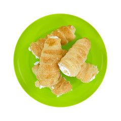 Cream horns on a green dish