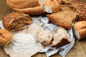 Breaking bread on wooden table