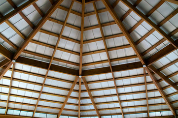 looking up at exposed beam roof