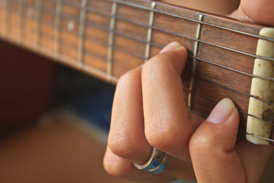 Girl Hand Playing Acoustic Guitar