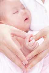 lovely baby with Mam use hand