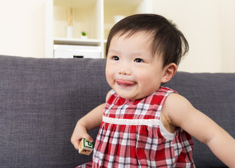 Baby girl laughing and showing tongue