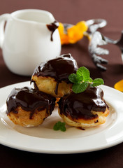 profiteroles with cream and chocolate sauce.