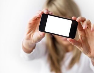 Woman taking self portrait with her mobile phone