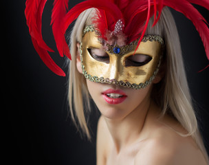 Fashion photo of beautiful woman in mask