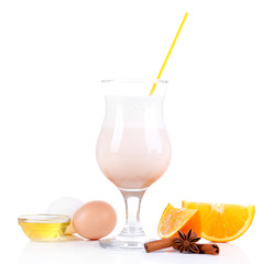 Eggnog with spices and orange isolated on white