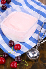 Ice cream in container and ice cream spoon