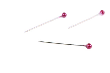 Many pins isolated on white.