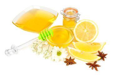 Sweet honey with lemon isolated on white