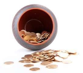 Golden coins falling out from pot, isolated on white background