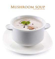 Mushroom soup in white bowl, on plate, isolated on white