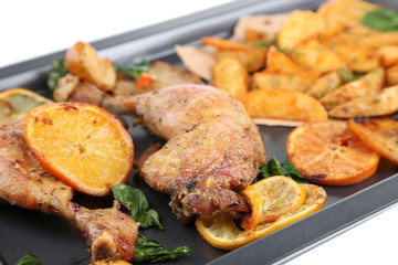 Homemade roasted chicken drumsticks with fried potatoes and