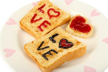 Delicious toast with jam on plate close-up