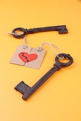Keys to heart, Conceptual photo. On color background
