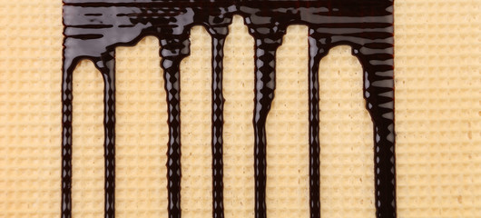 Background of wafer. Stream chocolate.