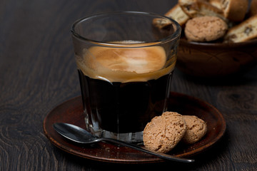 espresso and almond cookies on dark background