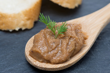 pate of chicken liver and roasted peppers in a spoon