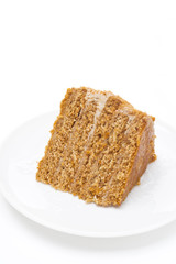 piece of honey cake on a white background