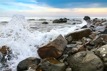 seascape, scenic large stones against the sea and sky