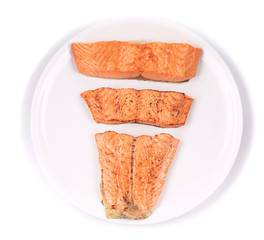 Slices of red fish fillet on plate.