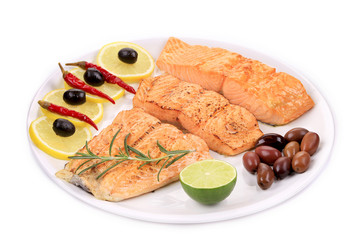 Grilled fillet of salmon on plate.