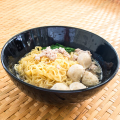 Eating instant noodle with minced pork and pork ball