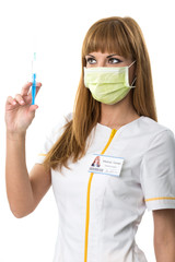 Pretty young nurse portrait, with  mouth mask and  injection