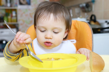 baby age of 16 months eating soup