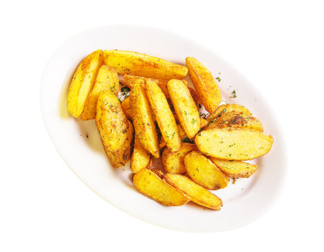 roasted potato wedges on a white plate