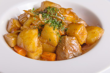 Beef bourguignon stew with roast potatoes