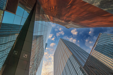 Skyward view of gigantic glass skyscrapers