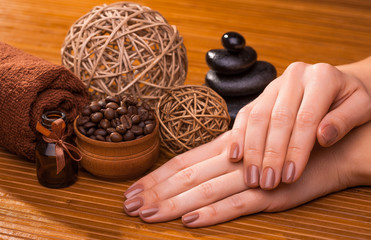 beautiful brown manicure on a bamboo background