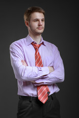 Businessman in a shirt and tie, standing in a free position