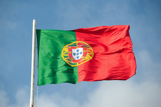 Flag of Portugal waving in the sky.
