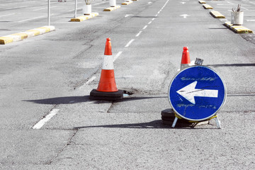 Road detour sign and cones due pothole