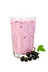 Milkshake with black currants in a glass