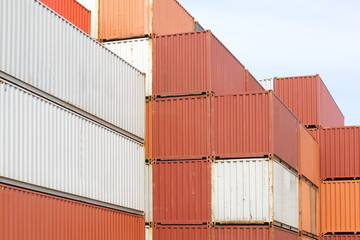 Stacked cargo containers in freight sea port terminal
